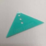 Regla alineacion de ojetillos